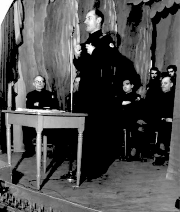 Young Christian leader Adrien Arcand lecturing on stage (date unknown)